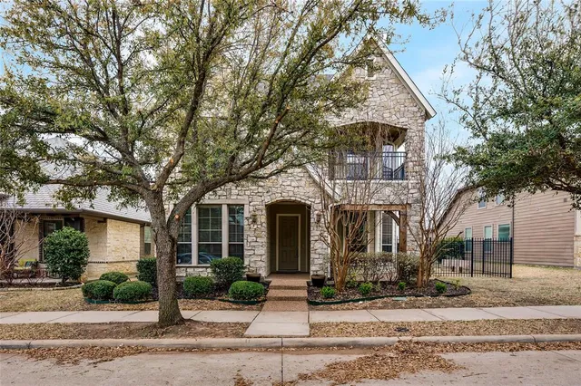 front view of a house with a small yard