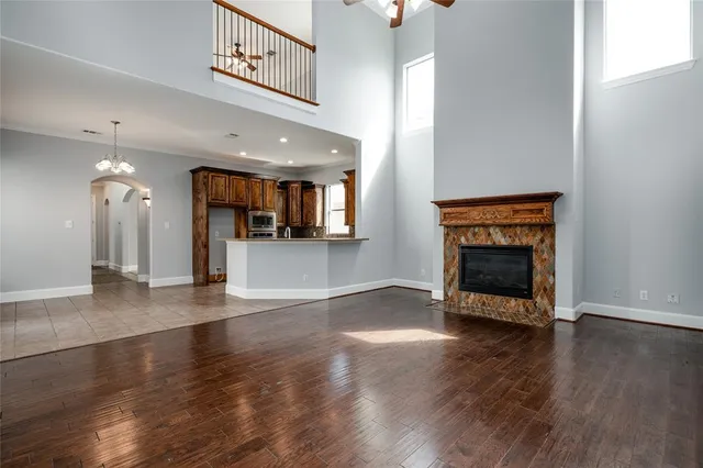 an entryway with fireplace and wooden floor