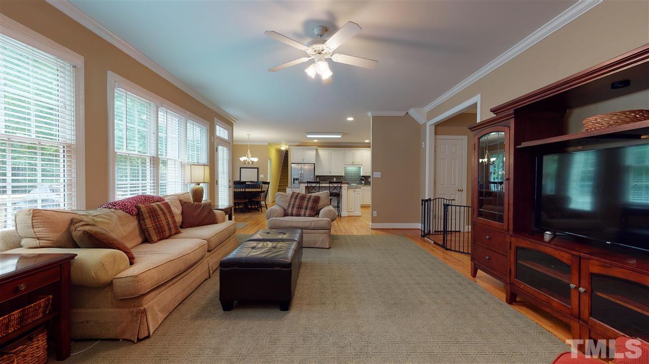 8005 Millenium Drive Raleigh, NC 27614 - Photo 14 of 30 a living room with furniture and a flat screen tv