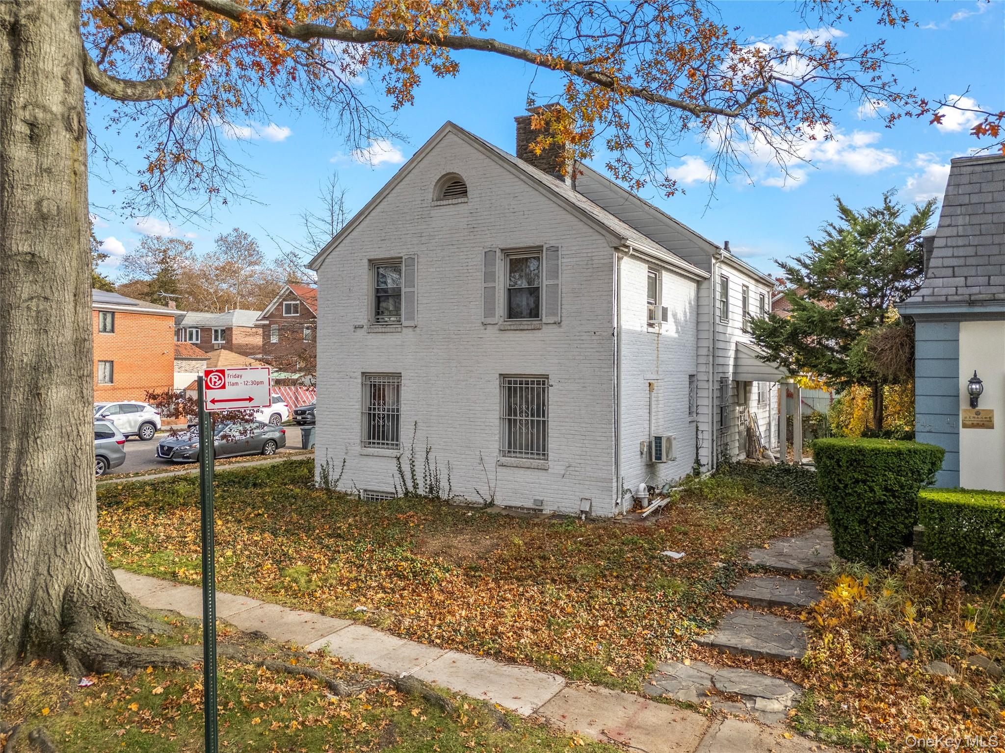 52-06 Bowne Street Queens, NY 11355 - Photo 7 of 17 a view of a house with a yard