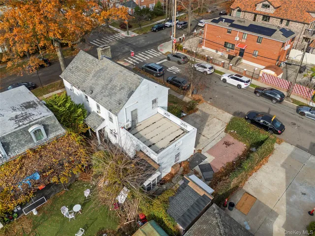 an aerial view of a house with a yard