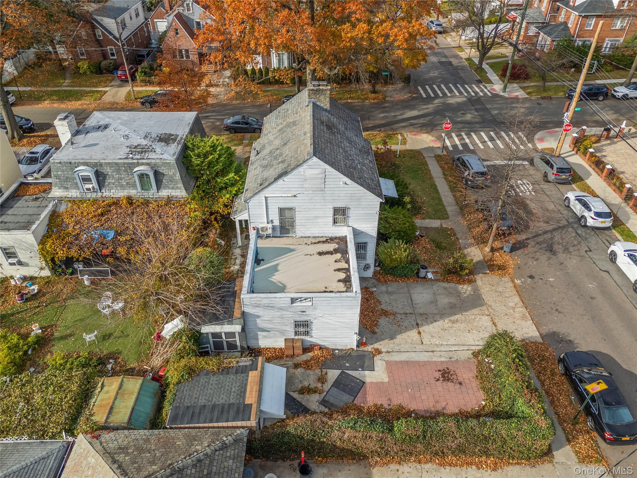 52-06 Bowne Street Queens, NY 11355 - Photo 10 of 17 an aerial view of a house with a yard