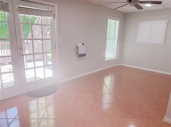 a view of an empty room with a window