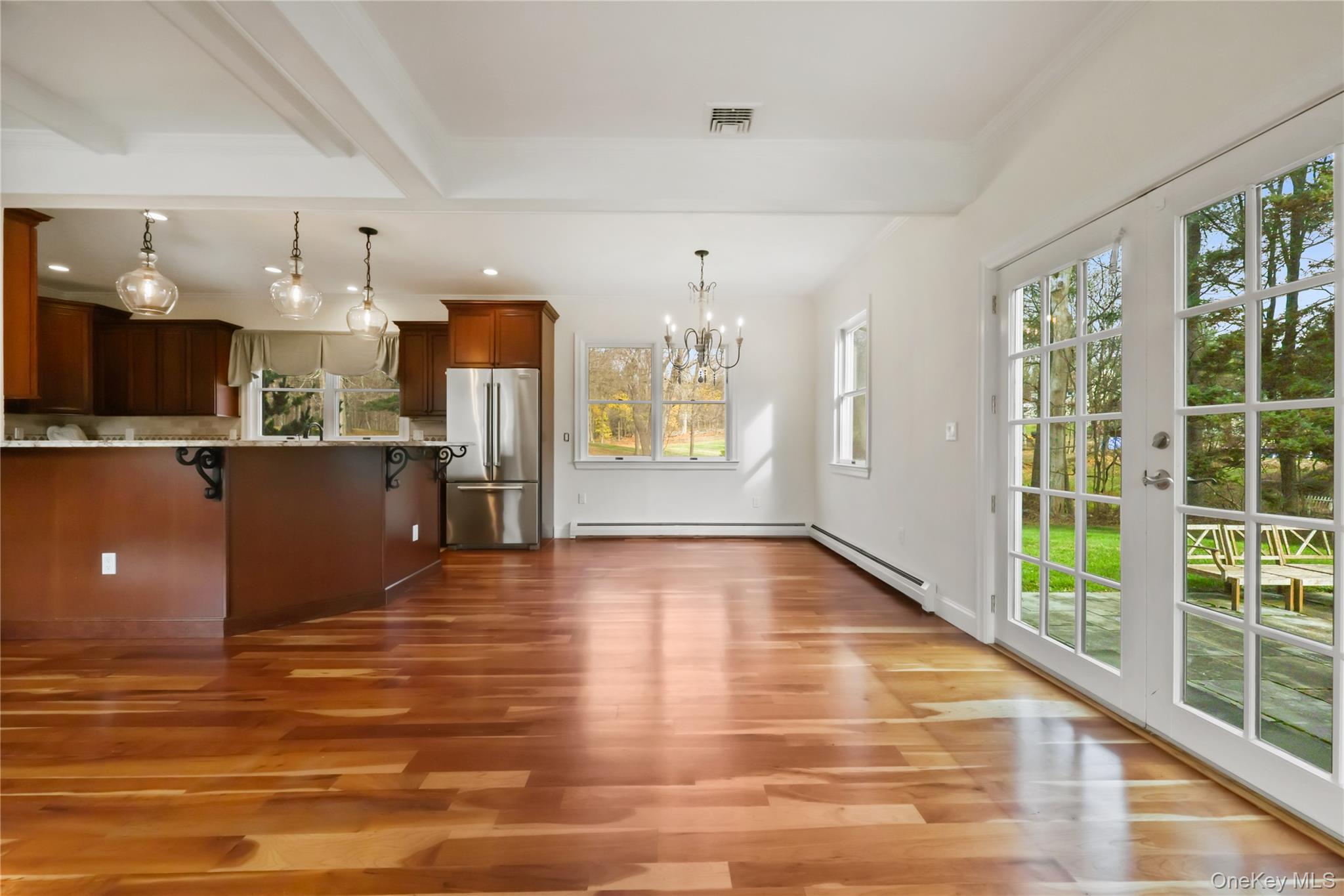 353 Turk Hill Road Brewster, NY 10509 - Photo 11 of 31 Kitchen with a chandelier, freestanding refrigerator, decorative light fixtures, dark wood-style floors, and recessed lighting