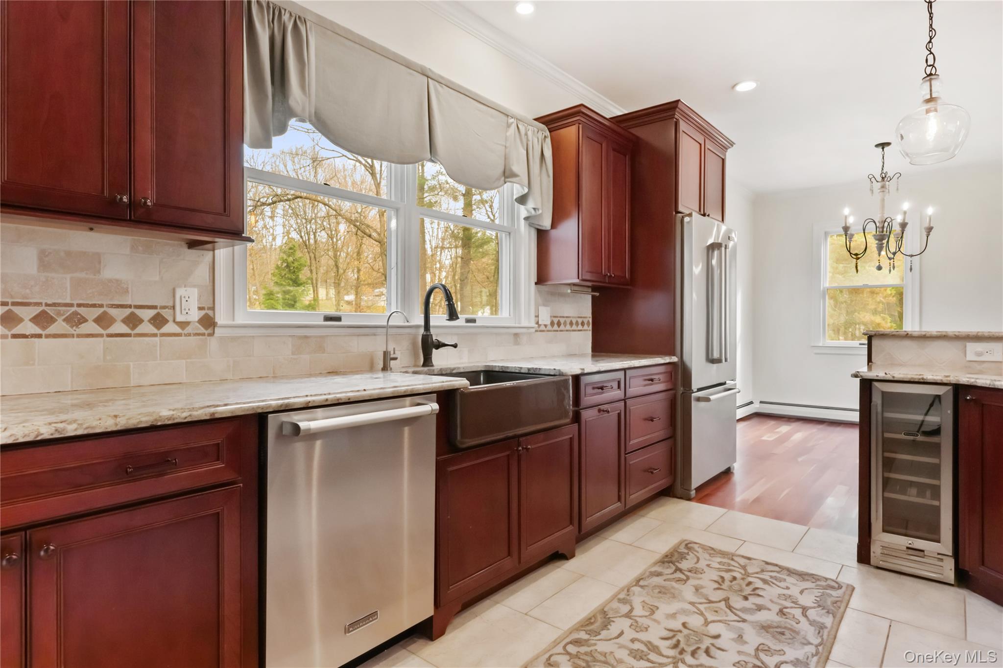 353 Turk Hill Road Brewster, NY 10509 - Photo 12 of 31 Kitchen with granite countertops, stainless steel appliances, hanging light fixtures and wine cooler