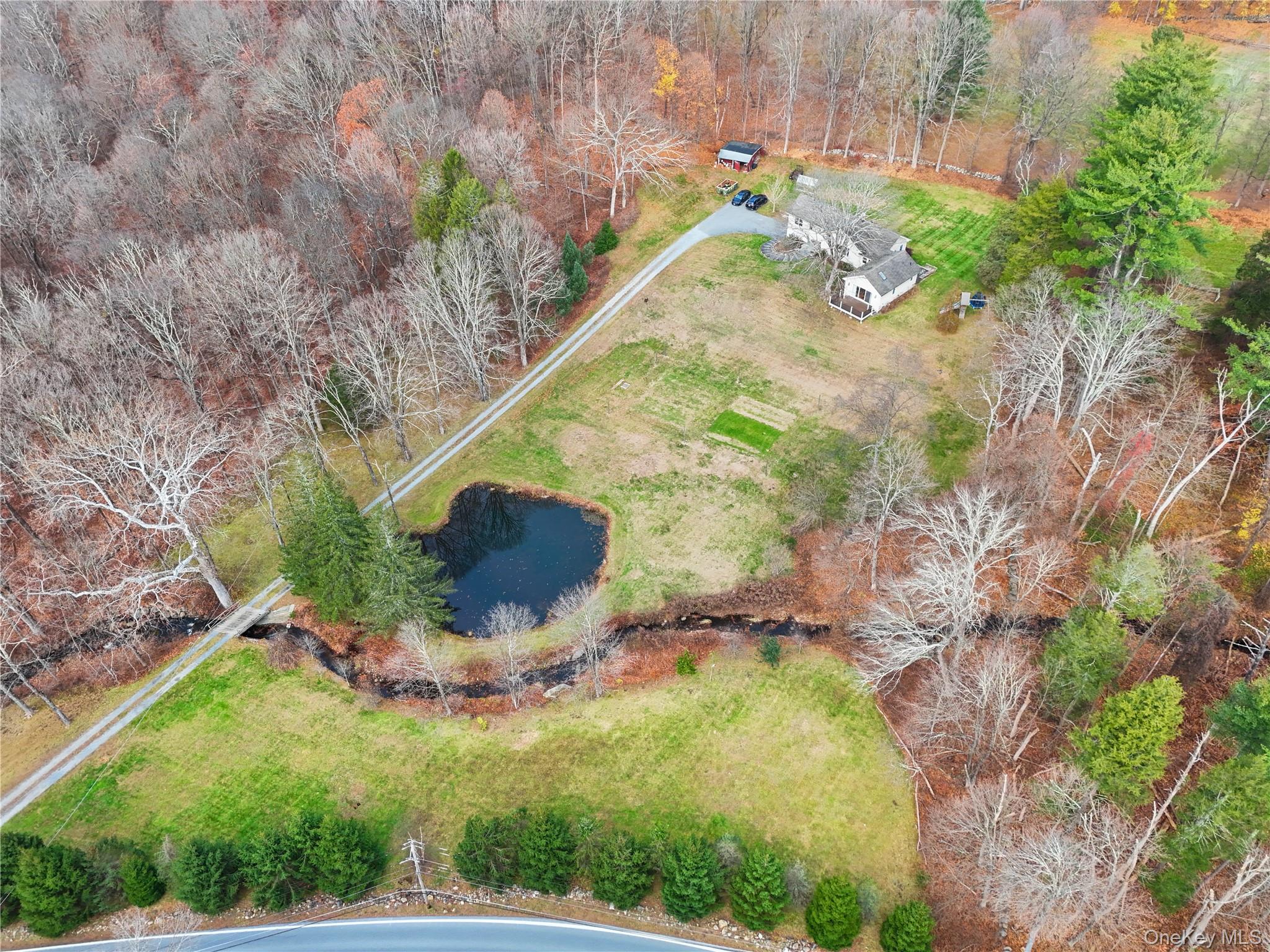 353 Turk Hill Road Brewster, NY 10509 - Photo 3 of 31 Aerial view of property and surrounding area with a large body of water