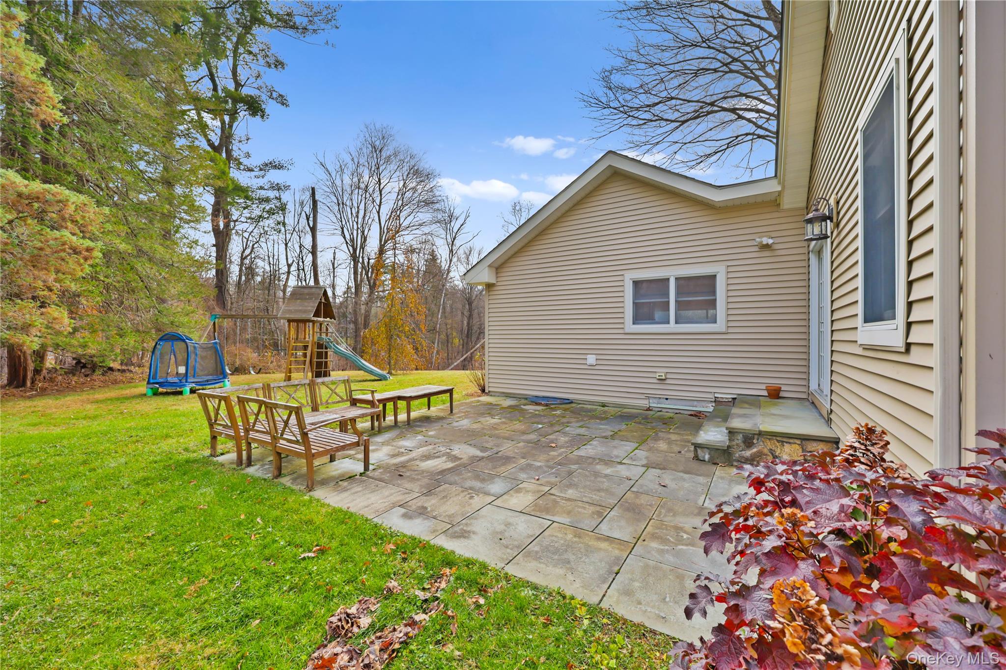 353 Turk Hill Road Brewster, NY 10509 - Photo 4 of 31 View of patio featuring a playground.