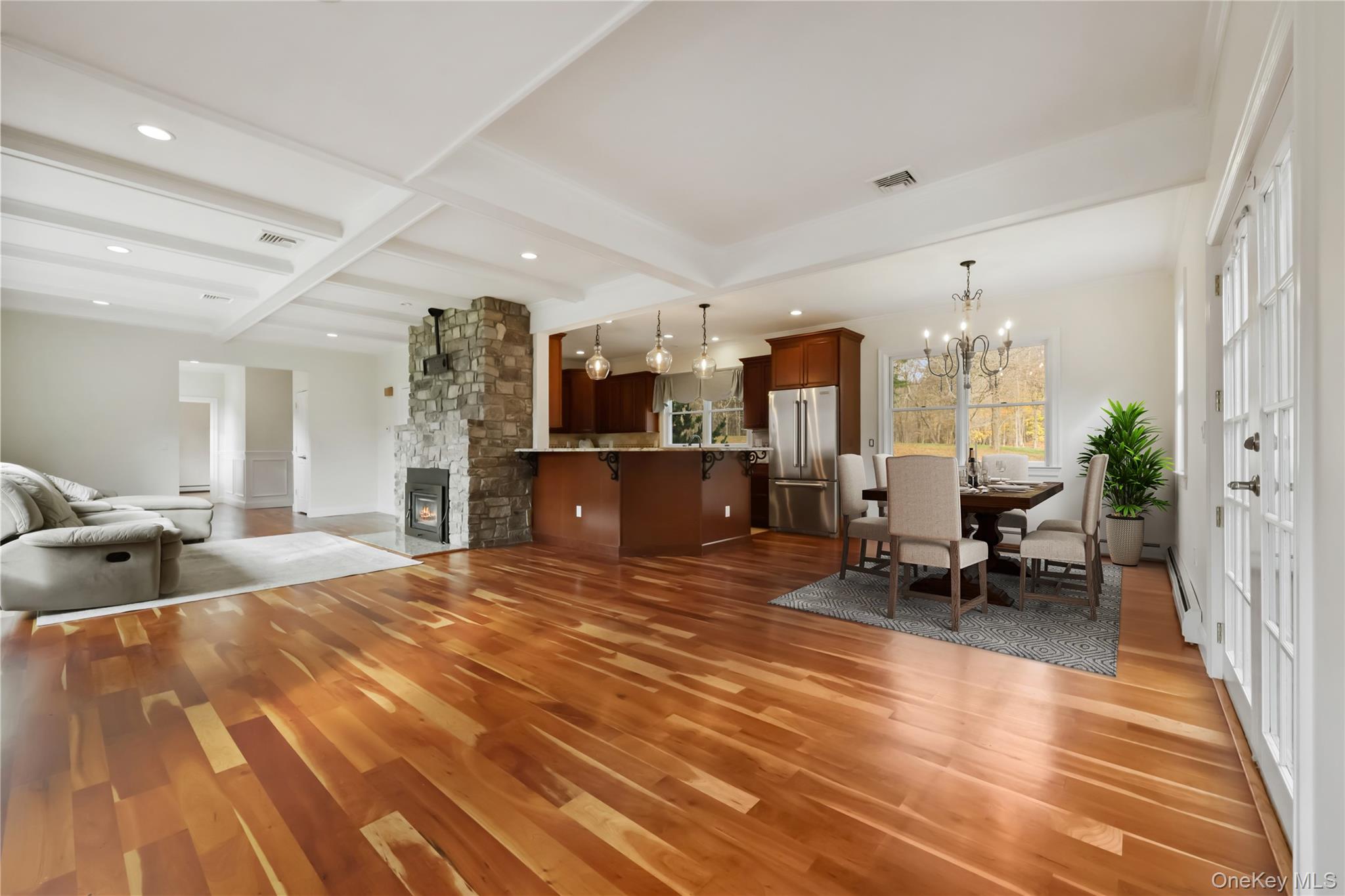 353 Turk Hill Road Brewster, NY 10509 - Photo 10 of 31 Virtually Staged. Dining space featuring beamed ceiling, a stone fireplace, a chandelier, and coffered ceiling