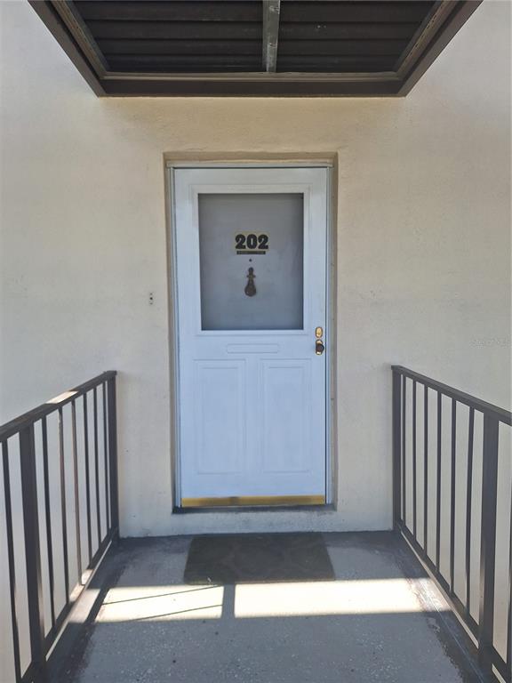 4518 Garnet Drive, Unit 202 New Port Richey, FL 34652 - Photo 12 of 66 a view of a door and a window