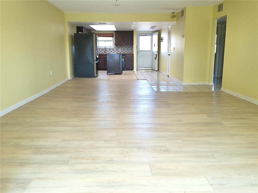 4518 Garnet Drive, Unit 202 New Port Richey, FL 34652 - Photo 15 of 66 a view of empty room with wooden floor