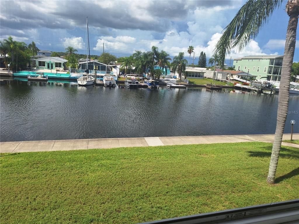 4518 Garnet Drive, Unit 202 New Port Richey, FL 34652 - Photo 20 of 66 a view of a lake with a house