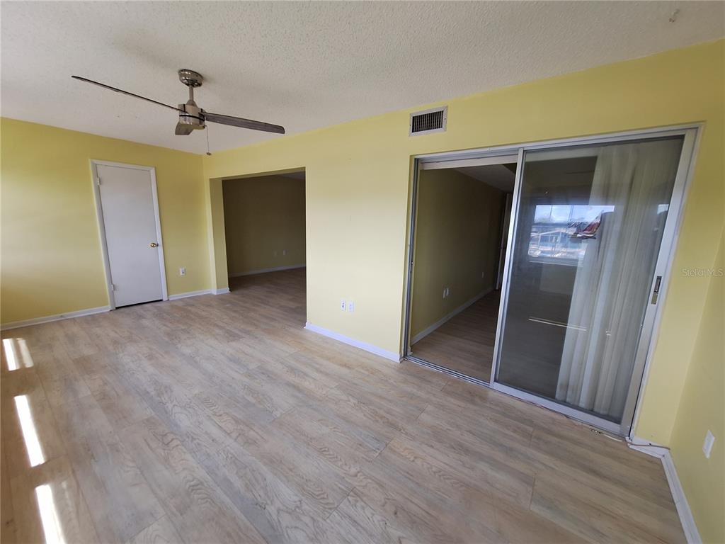 4518 Garnet Drive, Unit 202 New Port Richey, FL 34652 - Photo 21 of 66 a view of a hallway with wooden floor
