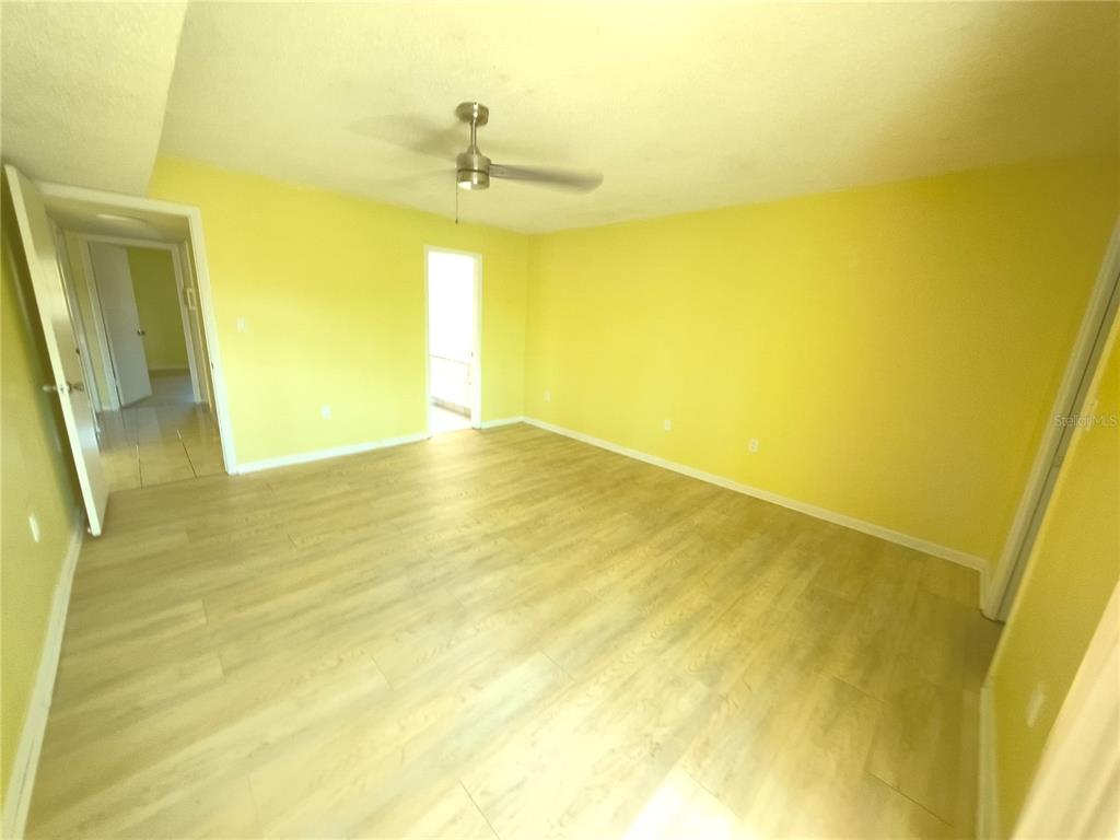 4518 Garnet Drive, Unit 202 New Port Richey, FL 34652 - Photo 25 of 66 a view of an empty room with wooden floor