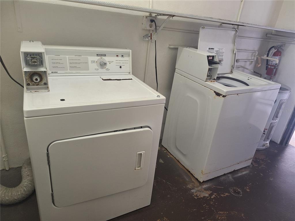 4518 Garnet Drive, Unit 202 New Port Richey, FL 34652 - Photo 45 of 66 a utility room with dryer and washer