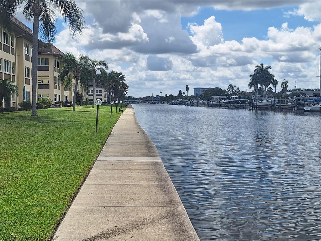 4518 Garnet Drive, Unit 202 New Port Richey, FL 34652 - Photo 47 of 66 a view of a lake with a yard