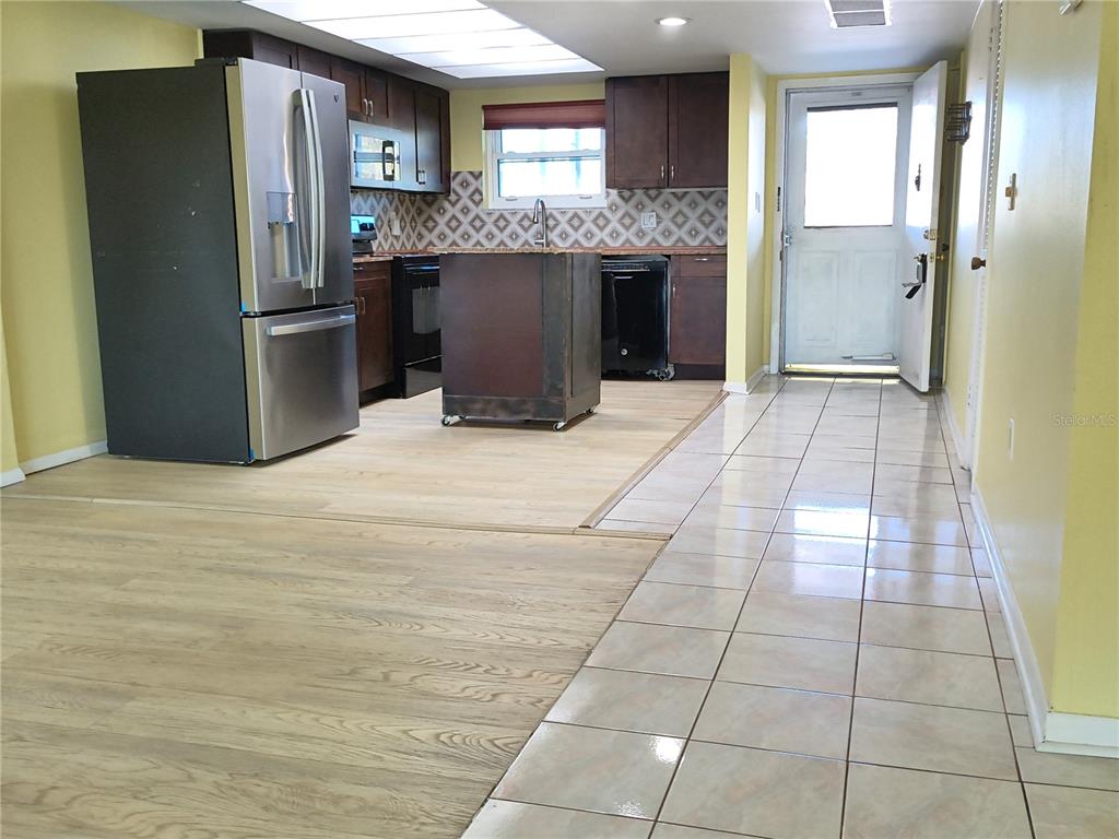 4518 Garnet Drive, Unit 202 New Port Richey, FL 34652 - Photo 6 of 66 a view of kitchen with stainless steel appliances granite countertop a refrigerator and a sink