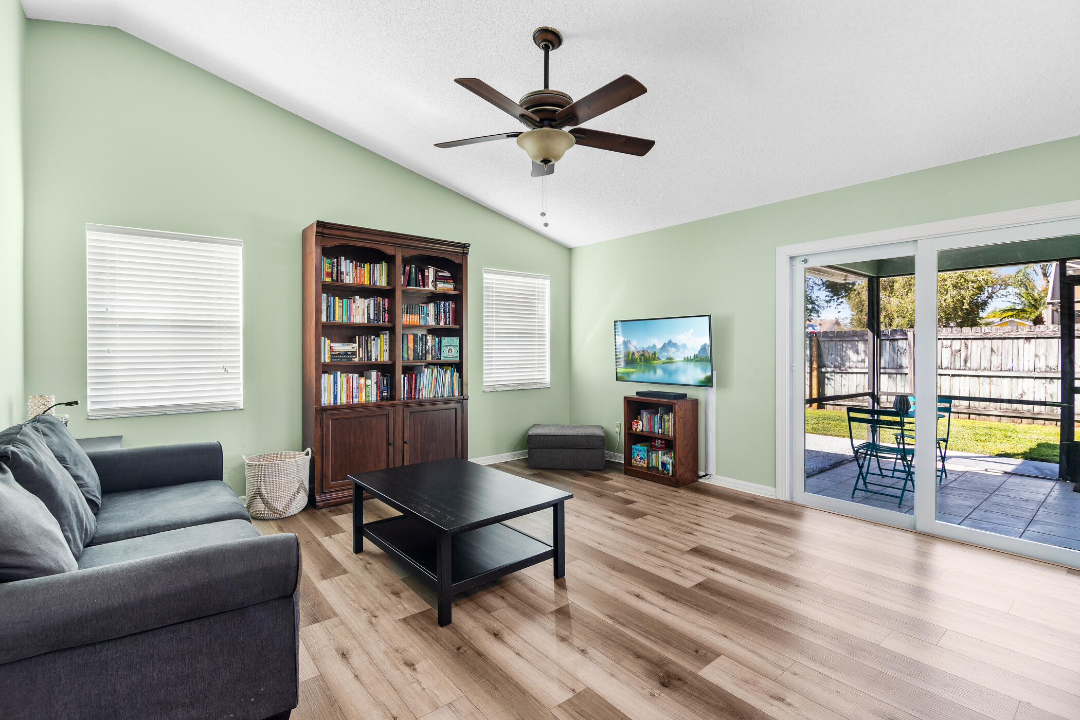 1197 Three Meadows Drive Rockledge, FL 32955 - Photo 17 of 25 a living room with furniture and fireplace