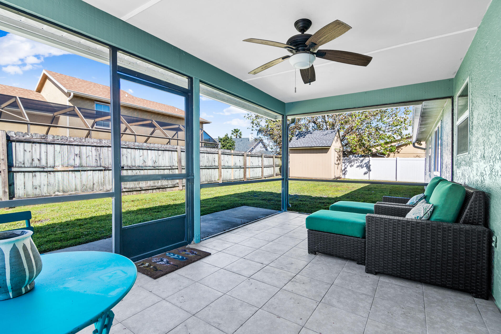 1197 Three Meadows Drive Rockledge, FL 32955 - Photo 21 of 25 a living room with furniture and a floor to ceiling window