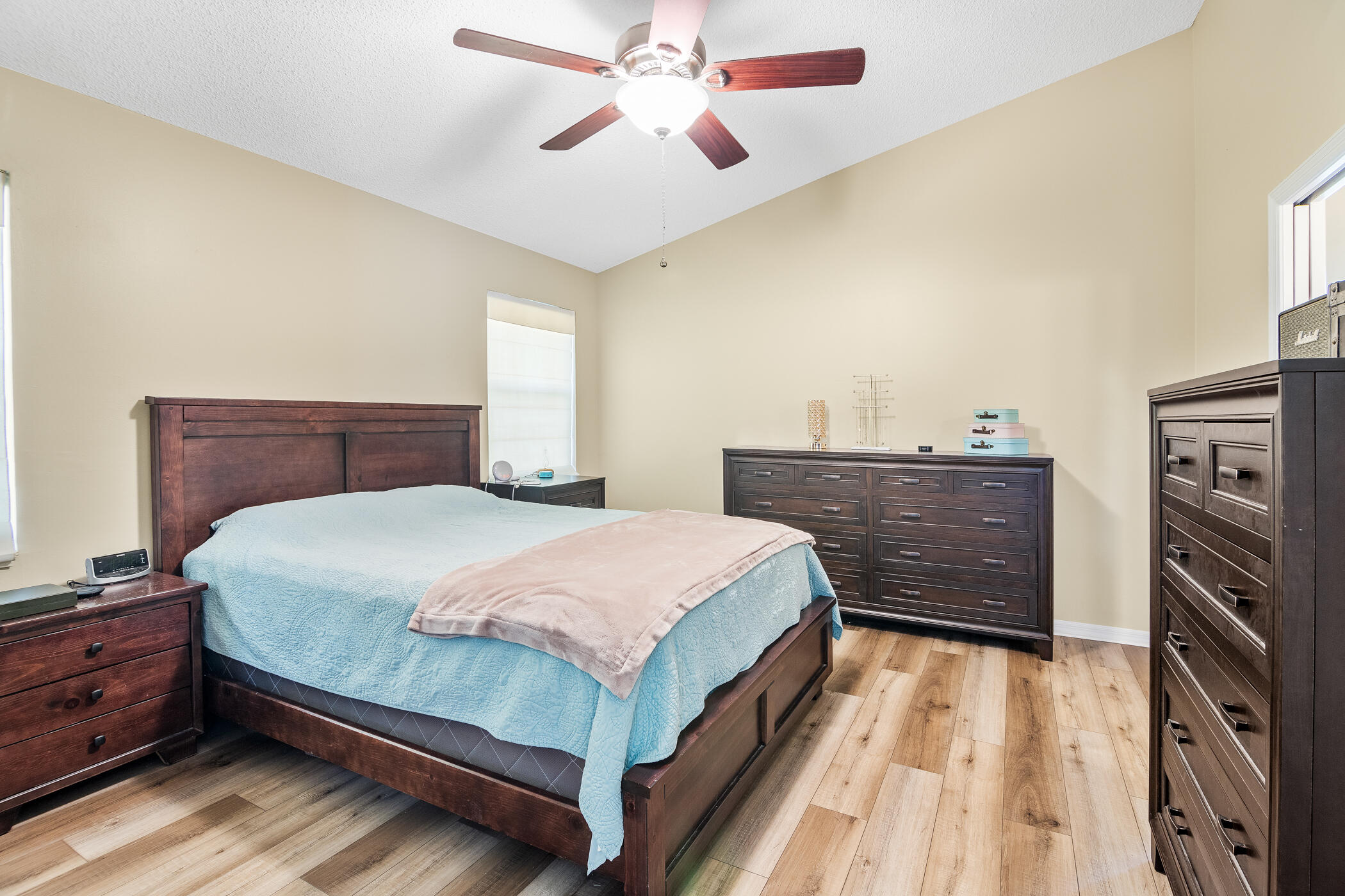 1197 Three Meadows Drive Rockledge, FL 32955 - Photo 8 of 25 a bedroom with a bed and a dresser