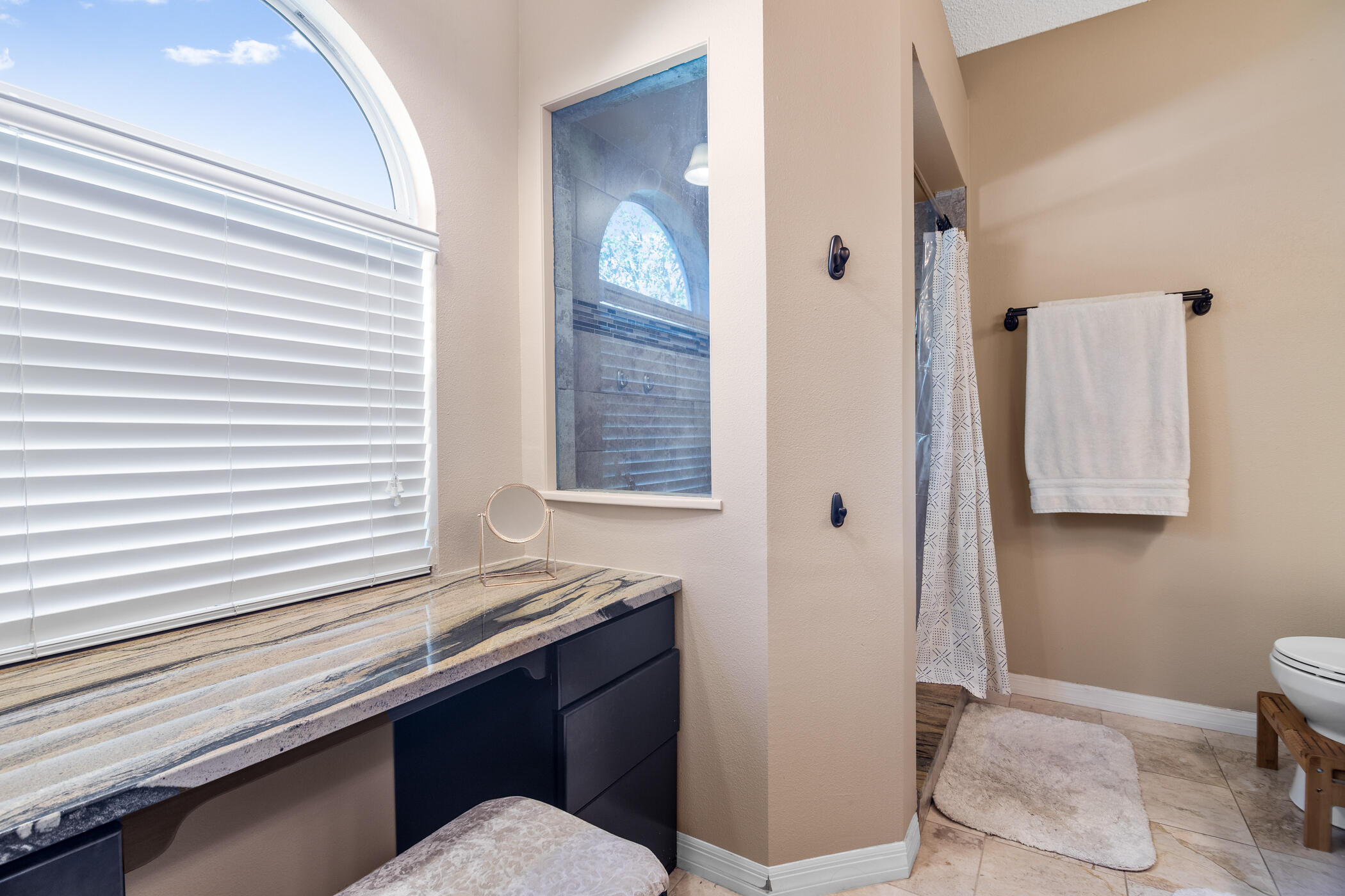 1197 Three Meadows Drive Rockledge, FL 32955 - Photo 10 of 25 a bathroom with a sink a toilet and mirror