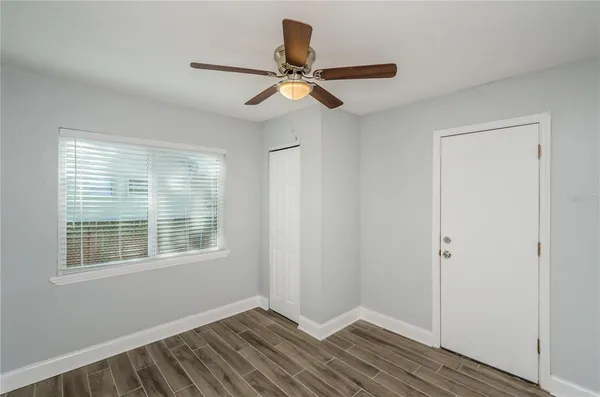 a view of an empty room with a window