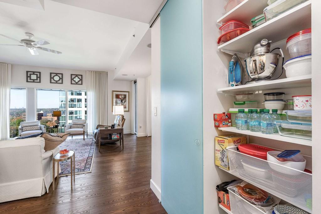 1820 Peachtree Road Northwest, Unit 1409 Atlanta, GA 30309 - Photo 11 of 44 a living room with furniture and a wooden floor