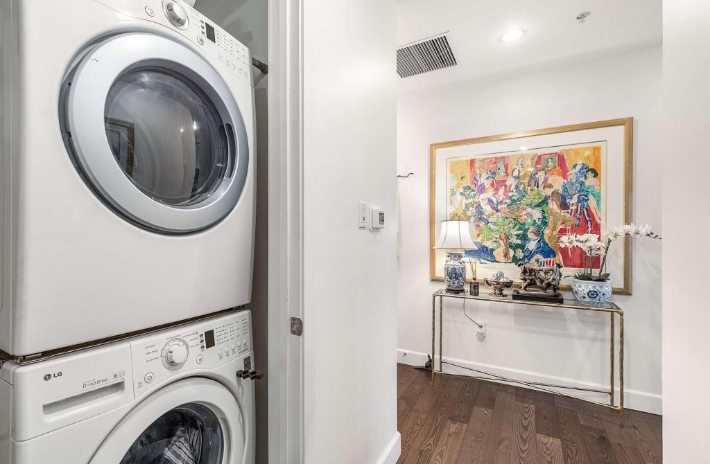 1820 Peachtree Road Northwest, Unit 1409 Atlanta, GA 30309 - Photo 12 of 44 a view of a storage and utility room with washer and dryer