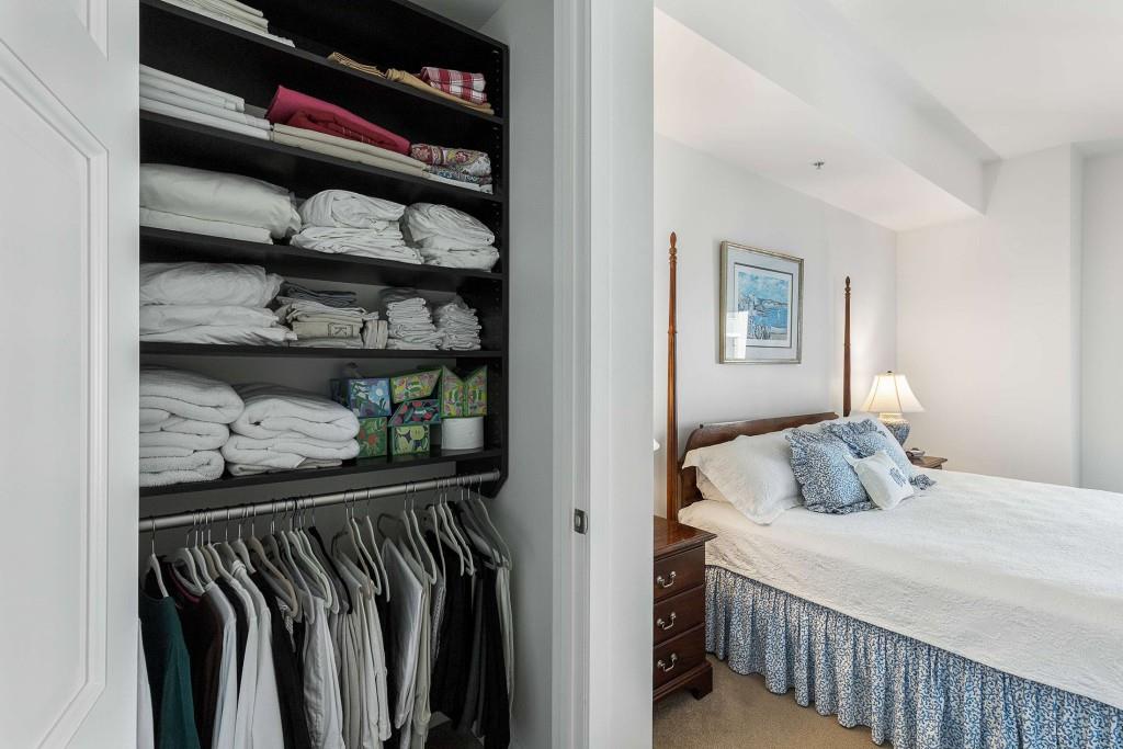 1820 Peachtree Road Northwest, Unit 1409 Atlanta, GA 30309 - Photo 17 of 44 a bedroom with a bed and closet