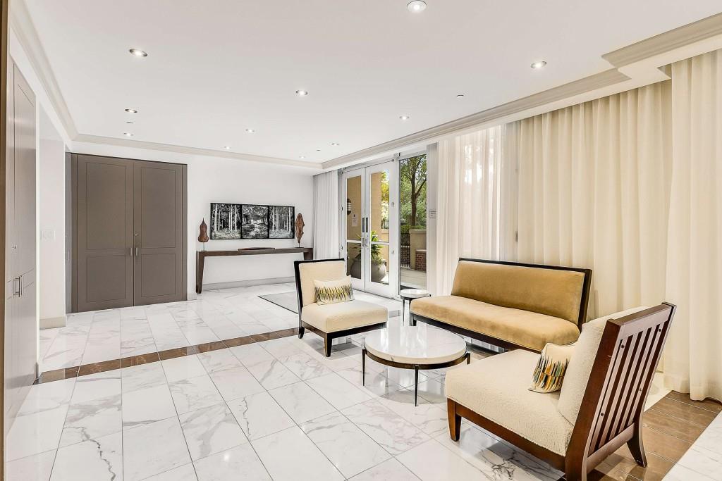 1820 Peachtree Road Northwest, Unit 1409 Atlanta, GA 30309 - Photo 33 of 44 a living room with furniture and a rug