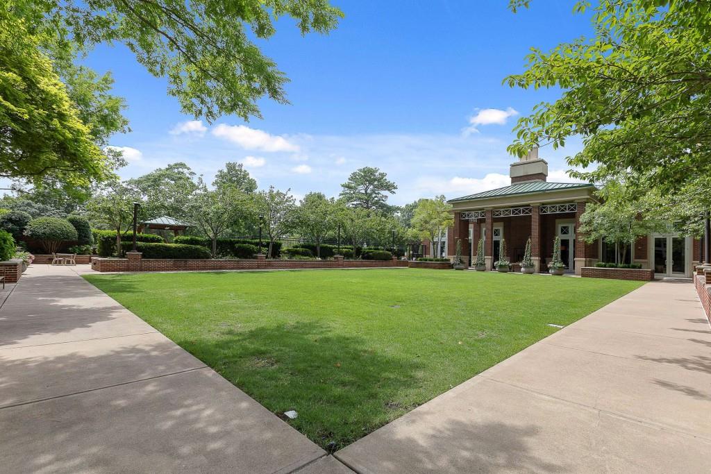 1820 Peachtree Road Northwest, Unit 1409 Atlanta, GA 30309 - Photo 40 of 44 a front view of a house with a yard