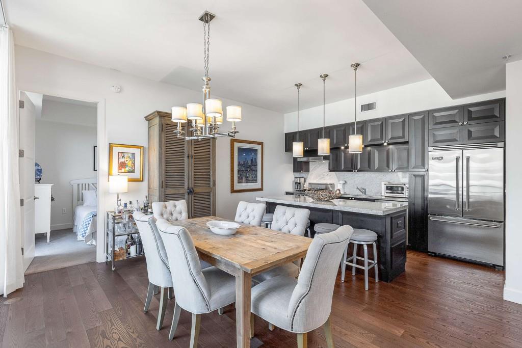 1820 Peachtree Road Northwest, Unit 1409 Atlanta, GA 30309 - Photo 7 of 44 a large kitchen with a table and chairs