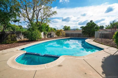 a view of a swimming pool with a patio