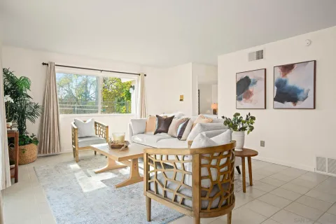 a view of a dining room with furniture large window and outside view
