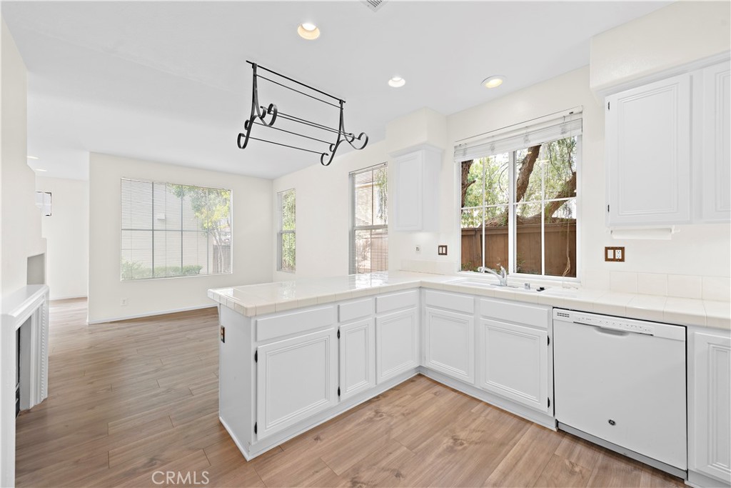68 Kyle Court Ladera Ranch, CA 92694 - Photo 15 of 33 a kitchen with white cabinets and window