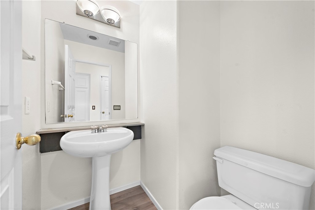 68 Kyle Court Ladera Ranch, CA 92694 - Photo 17 of 33 a bathroom with a toilet sink and mirror