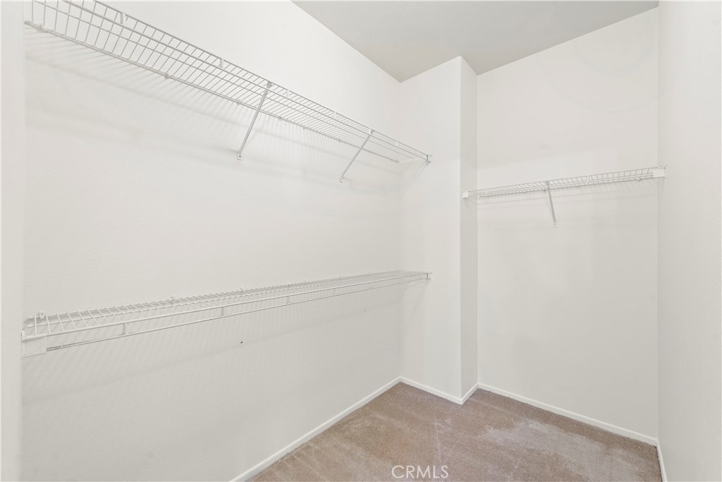 68 Kyle Court Ladera Ranch, CA 92694 - Photo 22 of 33 a view of a room with racks on the wall