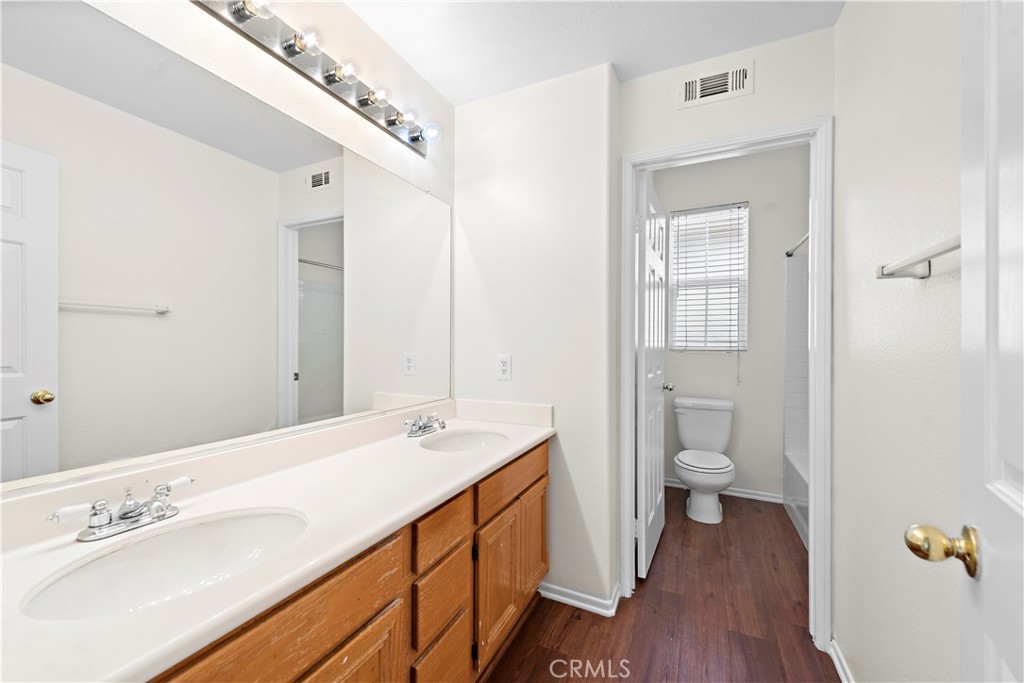 68 Kyle Court Ladera Ranch, CA 92694 - Photo 25 of 33 a spacious bathroom with a sink a toilet and shower