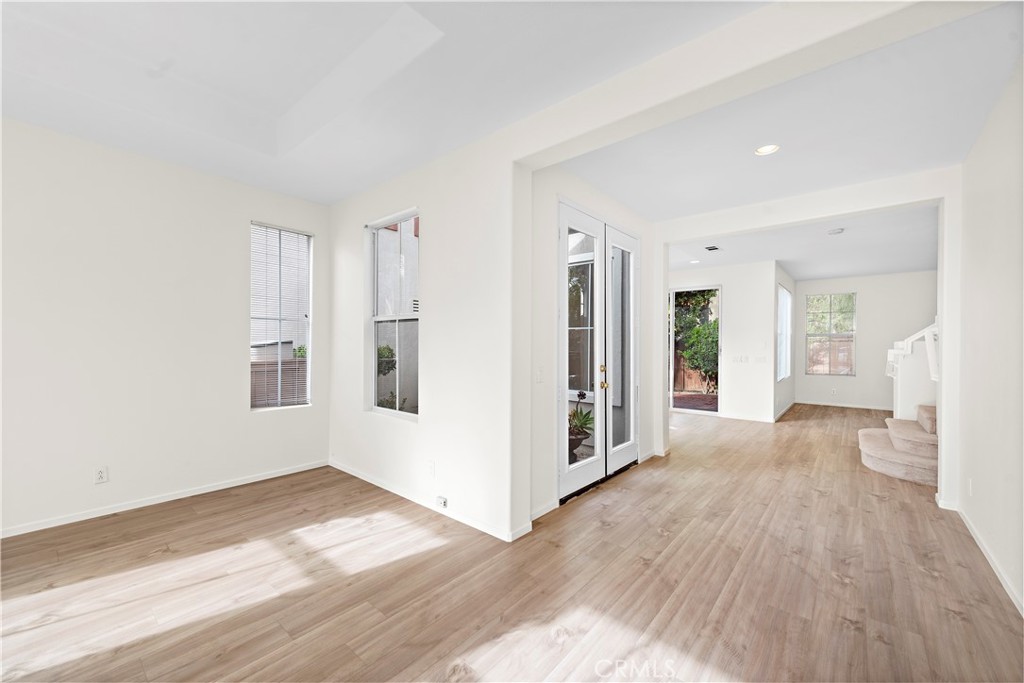 68 Kyle Court Ladera Ranch, CA 92694 - Photo 3 of 33 a view of a big room with wooden floor and windows