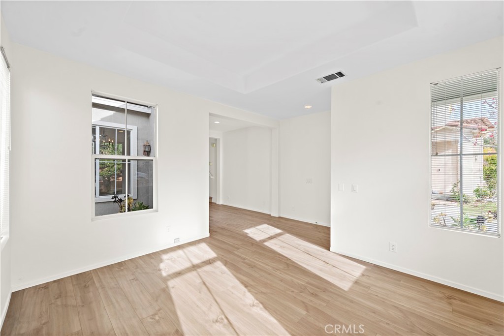 68 Kyle Court Ladera Ranch, CA 92694 - Photo 5 of 33 a view of an empty room with wooden floor and a window