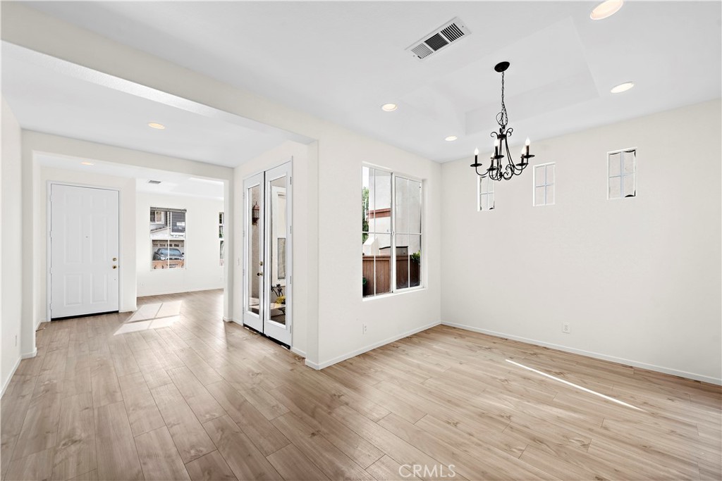 68 Kyle Court Ladera Ranch, CA 92694 - Photo 8 of 33 a view of an empty room with wooden floor and staircase