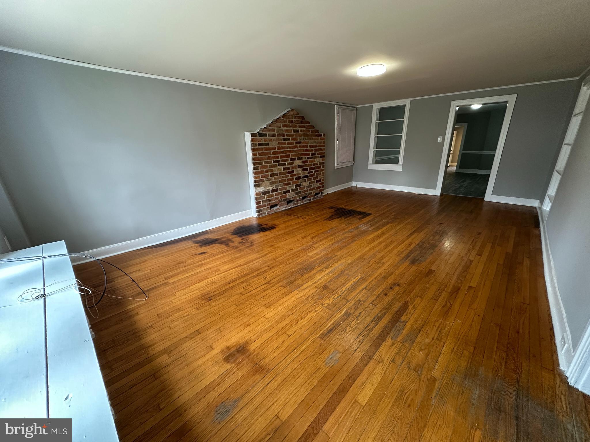 40 North Main Street Boonsboro, MD 21713 - Photo 21 of 75 a view of an empty room with wooden floor and a window
