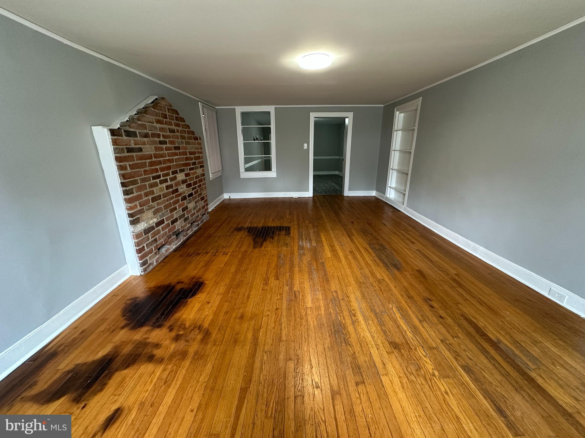 40 North Main Street Boonsboro, MD 21713 - Photo 22 of 75 a view of an empty room with wooden floor and a window