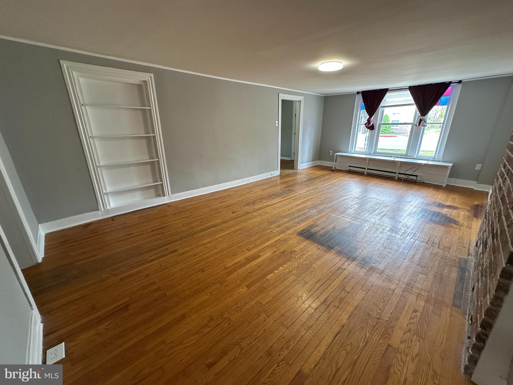 40 North Main Street Boonsboro, MD 21713 - Photo 24 of 75 wooden floor in an empty room with a window