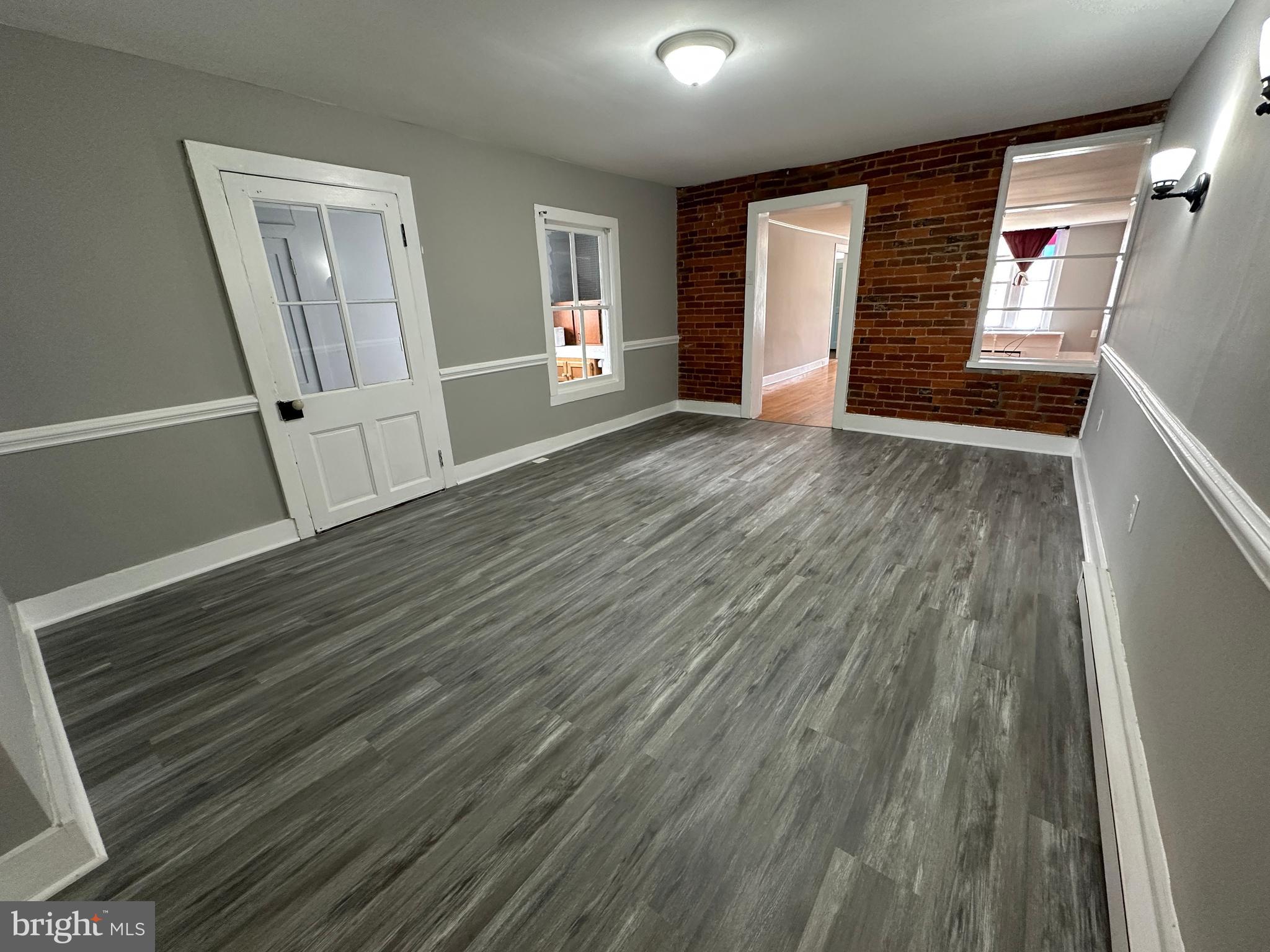 40 North Main Street Boonsboro, MD 21713 - Photo 27 of 75 an empty room with wooden floor and windows