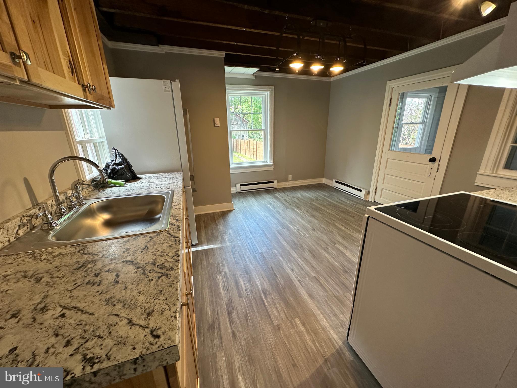 40 North Main Street Boonsboro, MD 21713 - Photo 28 of 75 a kitchen with granite countertop a sink and a stove top oven