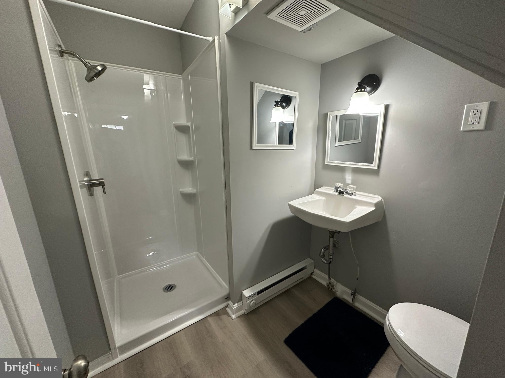 40 North Main Street Boonsboro, MD 21713 - Photo 40 of 75 a bathroom with a toilet sink and shower