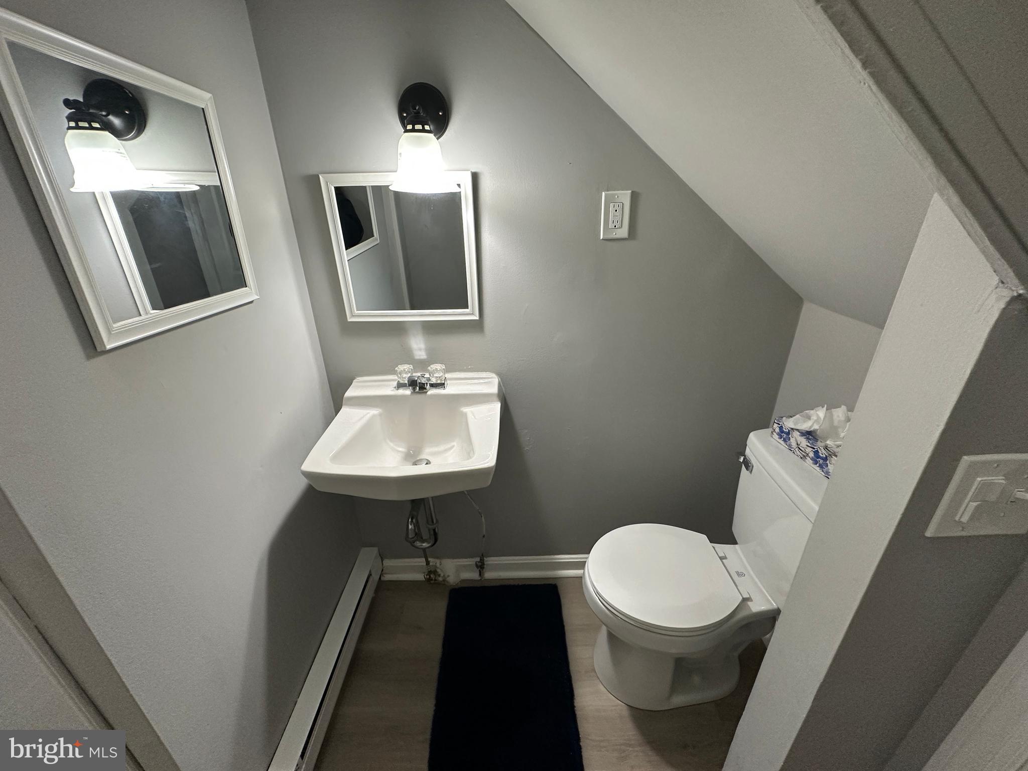 40 North Main Street Boonsboro, MD 21713 - Photo 41 of 75 a bathroom with a toilet sink and mirror