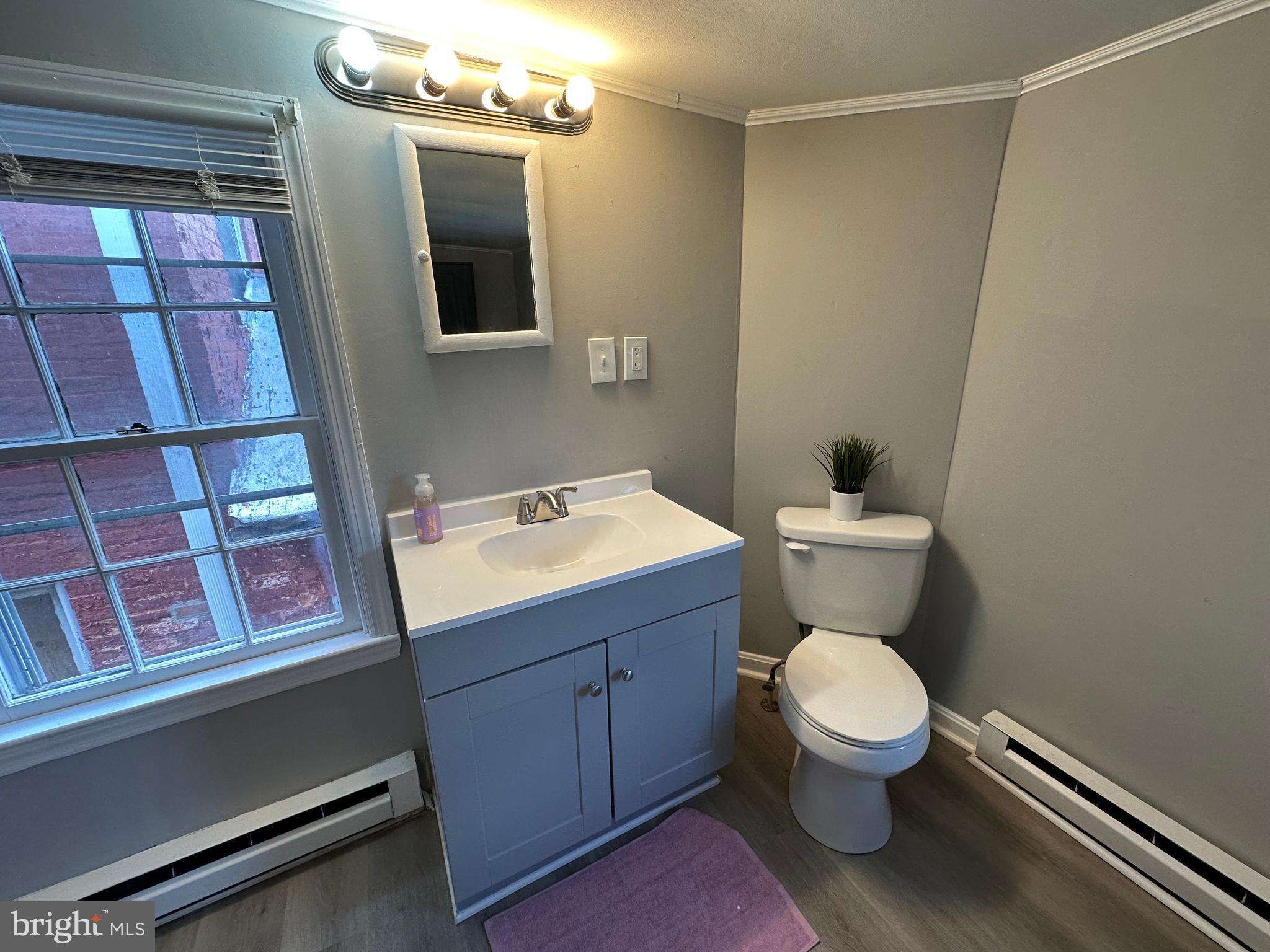 40 North Main Street Boonsboro, MD 21713 - Photo 54 of 75 a bathroom with a toilet sink and mirror