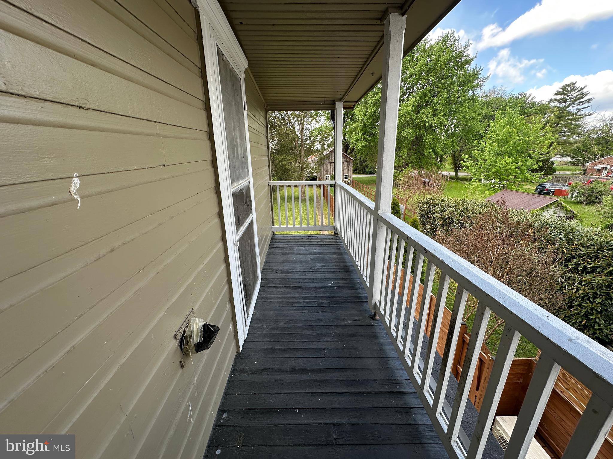 40 North Main Street Boonsboro, MD 21713 - Photo 63 of 75 a view of a porch with wooden floor and stairs