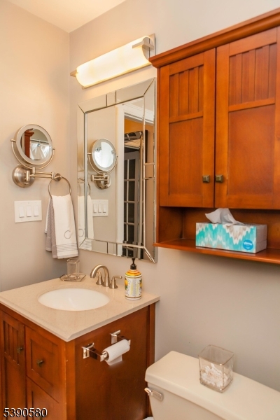 309 1st Street, Unit 3C Hoboken, NJ 07030 - Photo 11 of 12 a bathroom with a sink a toilet and mirror